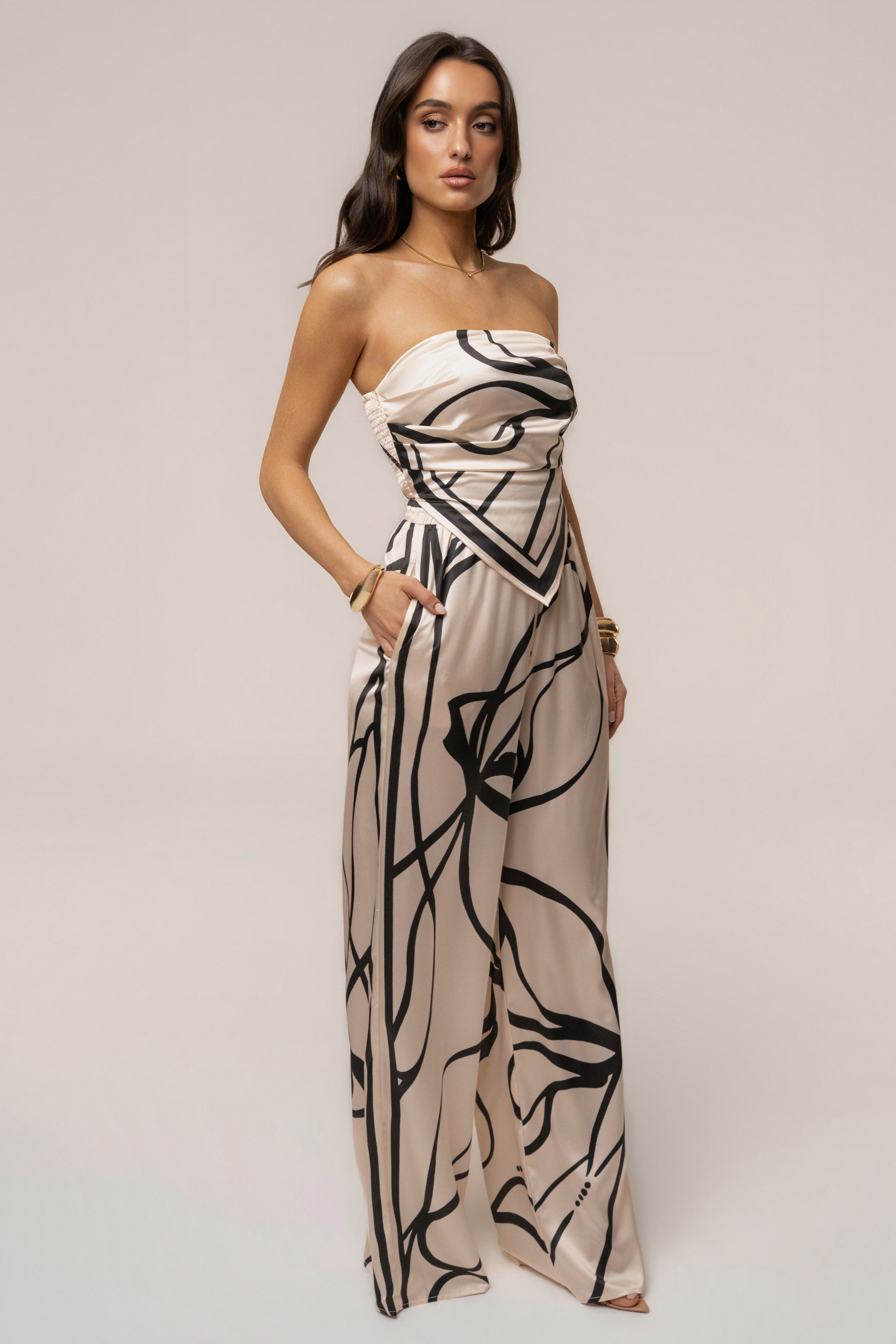 Cream and black art form pant set by JLUXLABEL, featuring stylish matching top and pants with artistic fabric design.