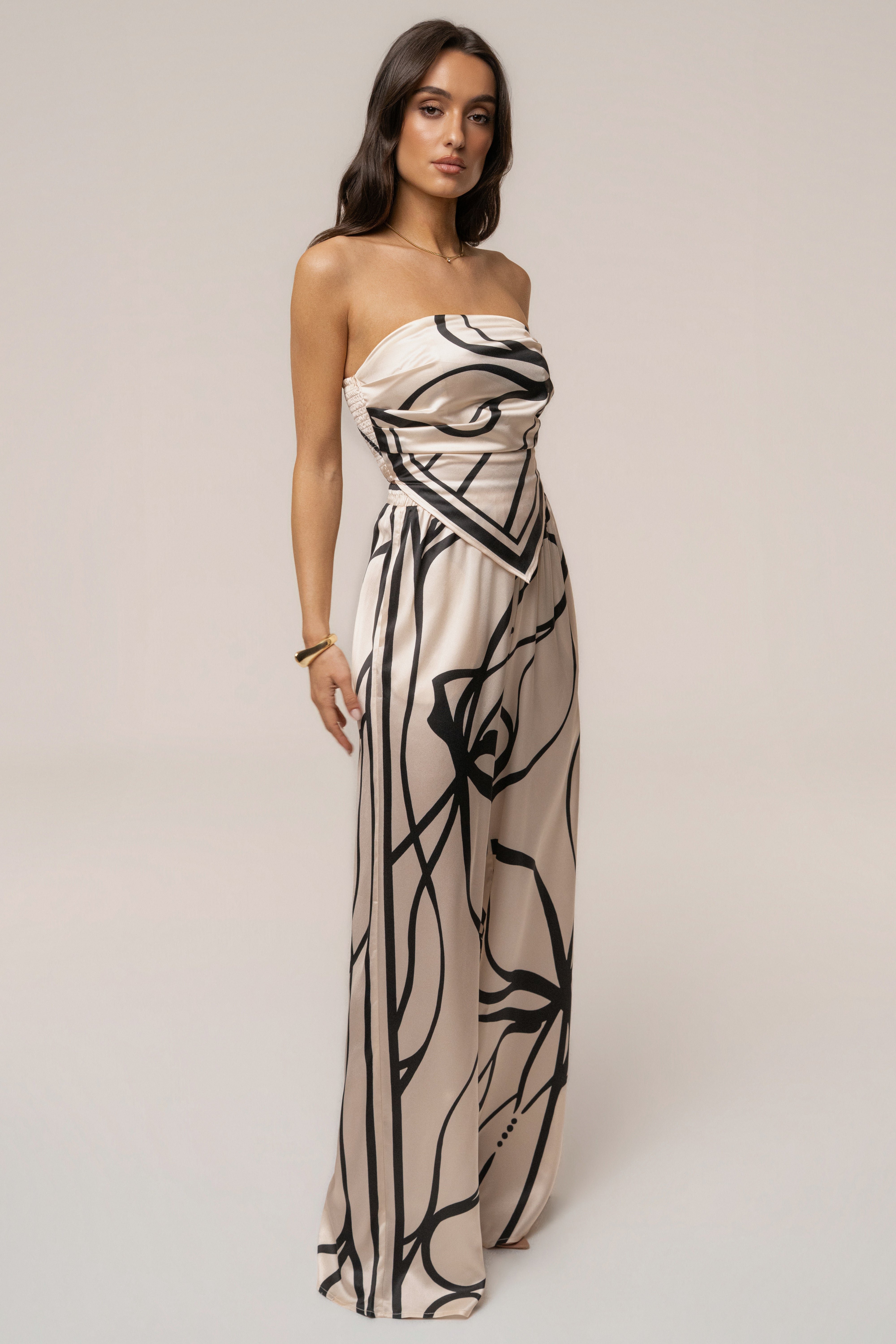 Cream and black art form pant set by JLUXLABEL featuring stylish, comfortable matching top and pants ensemble.