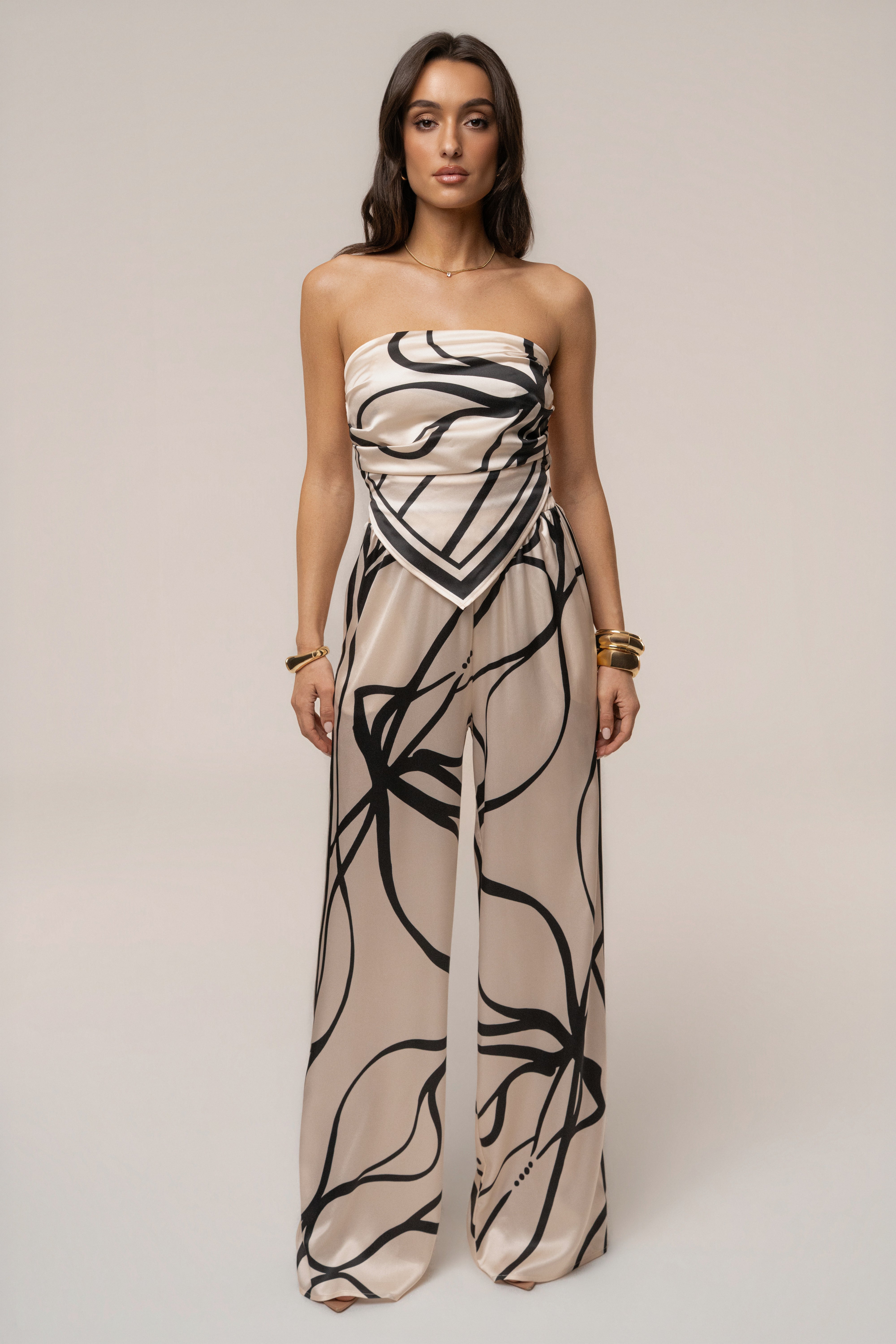 Cream and black art form pant set by JLUXLABEL featuring stylish high-waisted pants and a coordinating top.