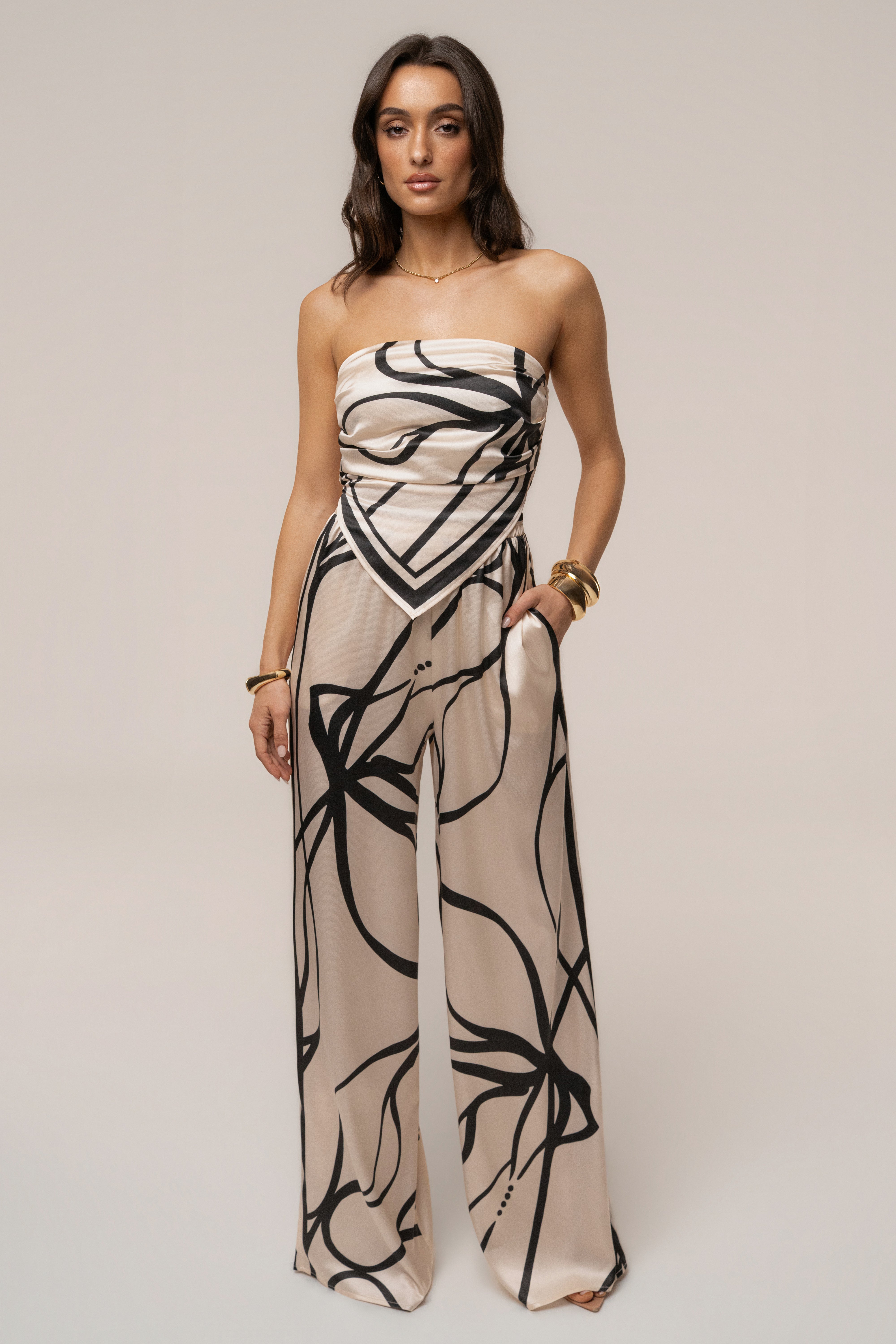 Cream and black art form pant set by JLUXLABEL, featuring stylish matching top and pants with artistic design.