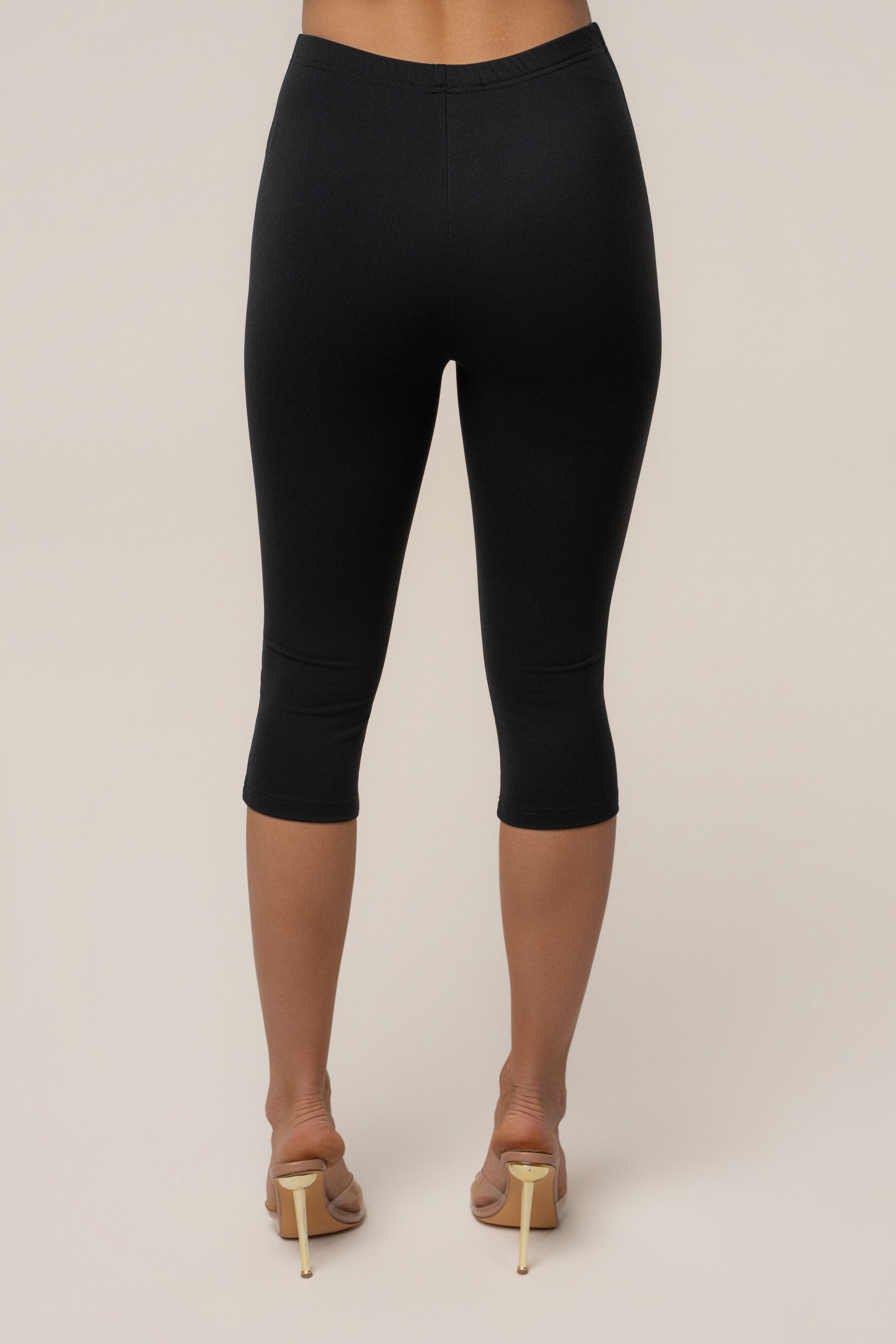 Black JLUXLABEL Essential Capri Legging shown as a comfortable, fitted bottom garment perfect for active or casual wear.