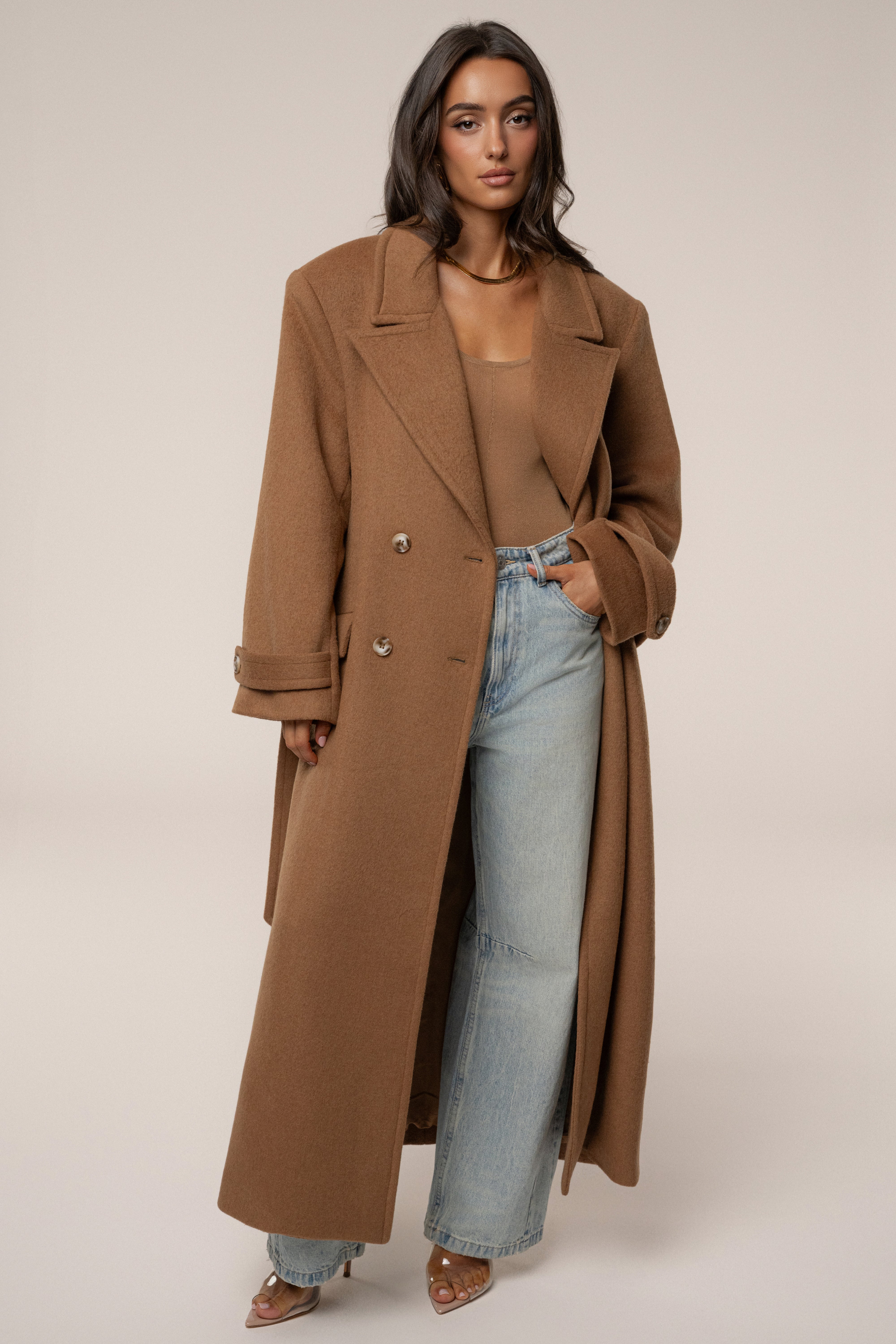 JLUXLABEL Camel Empire longline coat, stylish outerwear with a tailored fit and button details, displayed on a hanger.