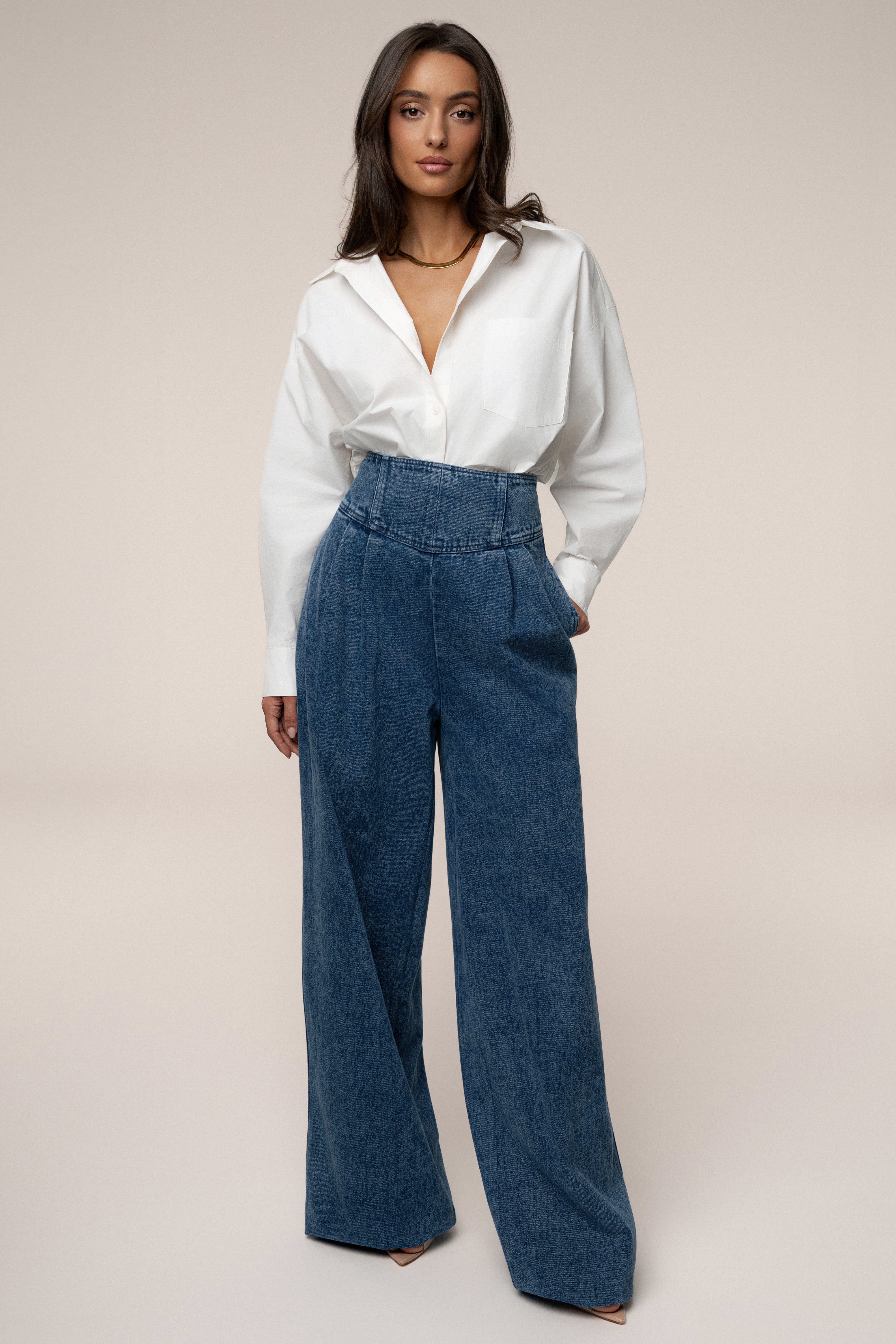 Medium wash denim pleated pants by JLUXLABEL, stylish bottoms with a relaxed fit and classic design.