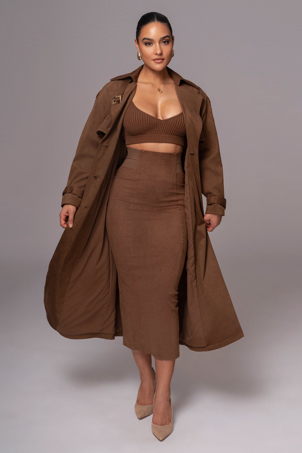 Chocolate suede Phoenix skirt by JLUXLABEL featuring a sleek, fitted design with a slight flare at the hem.