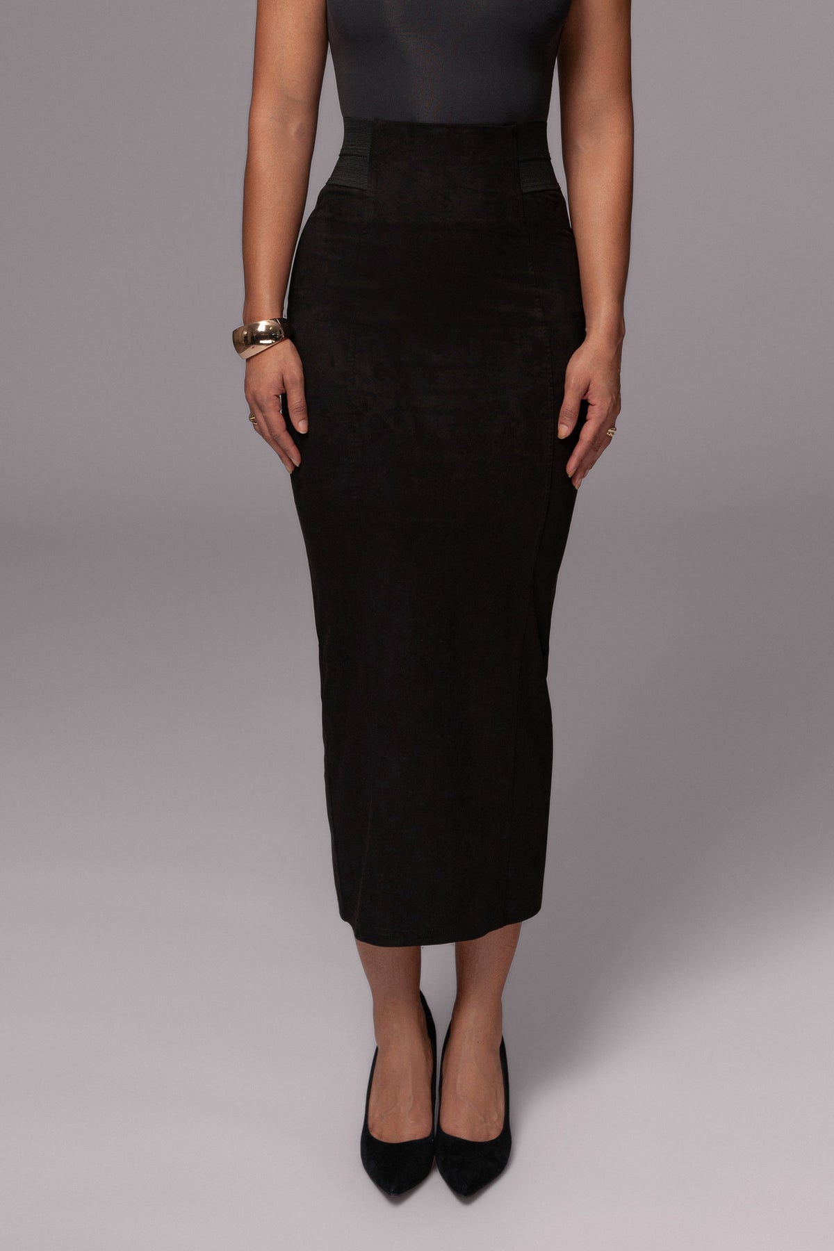 Black Phoenix suede skirt from JLUXLABEL, shown as a stylish bottom with a fitted waist and sleek A-line silhouette.