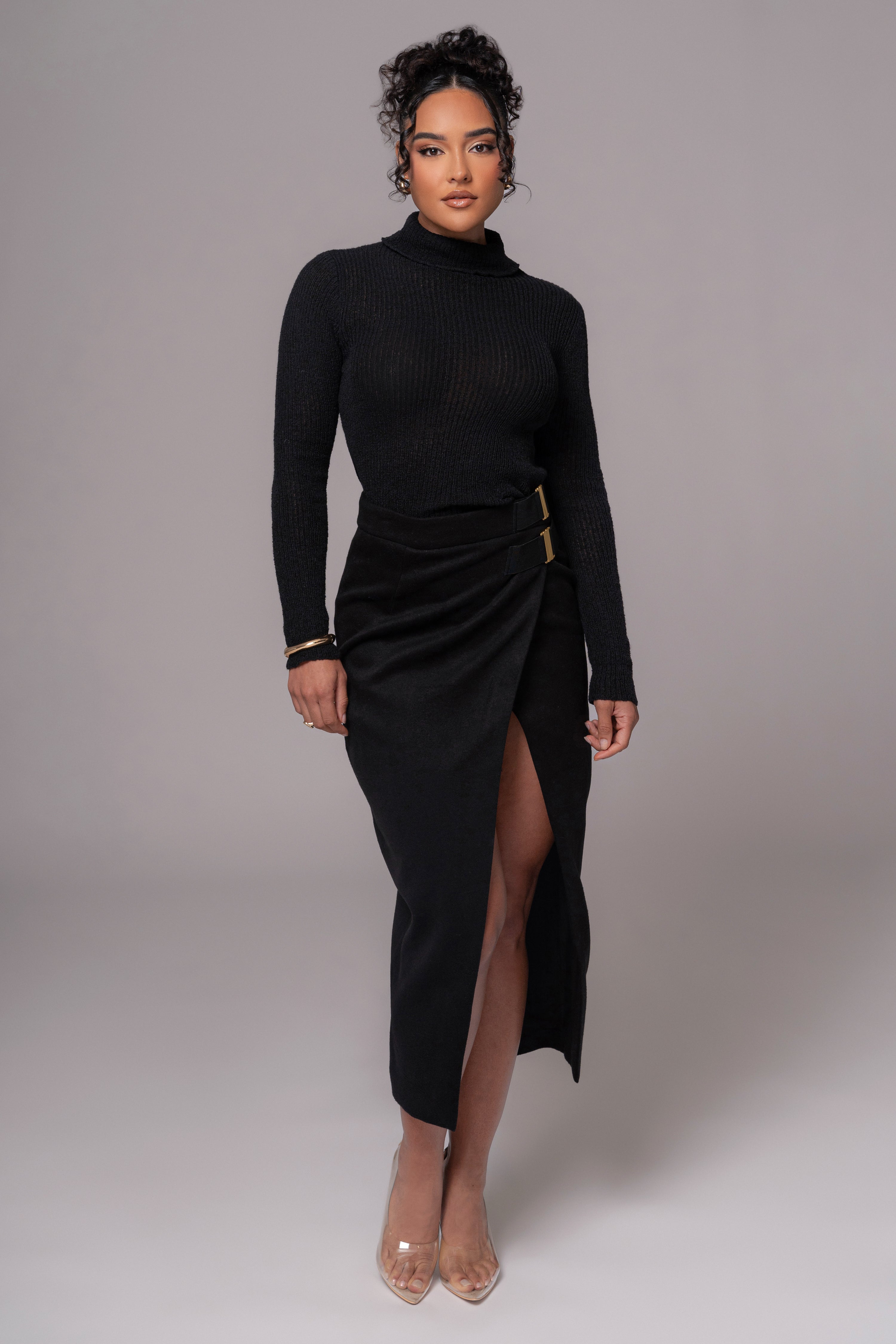 Black Gisele slit skirt from JLUXLABEL, showcasing a stylish, flowy bottom with a high slit, perfect for chic outfits.