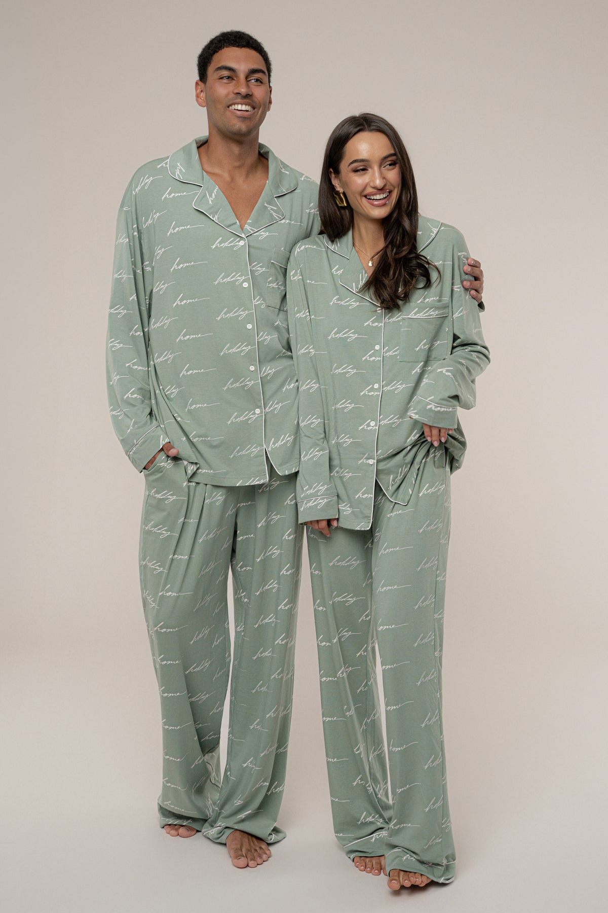 JLUXLABEL Sage Home For The Holidays adult pajama set with festive red and green patterned tops and matching pants.