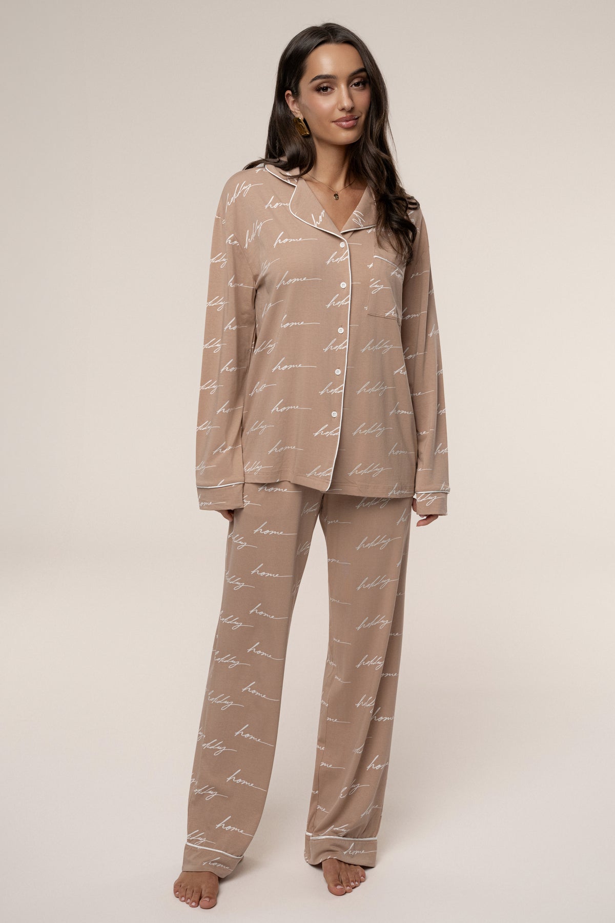 Beige JLUXLABEL adult pajama set with long sleeve top and matching pants, cozy holiday-themed loungewear for women.