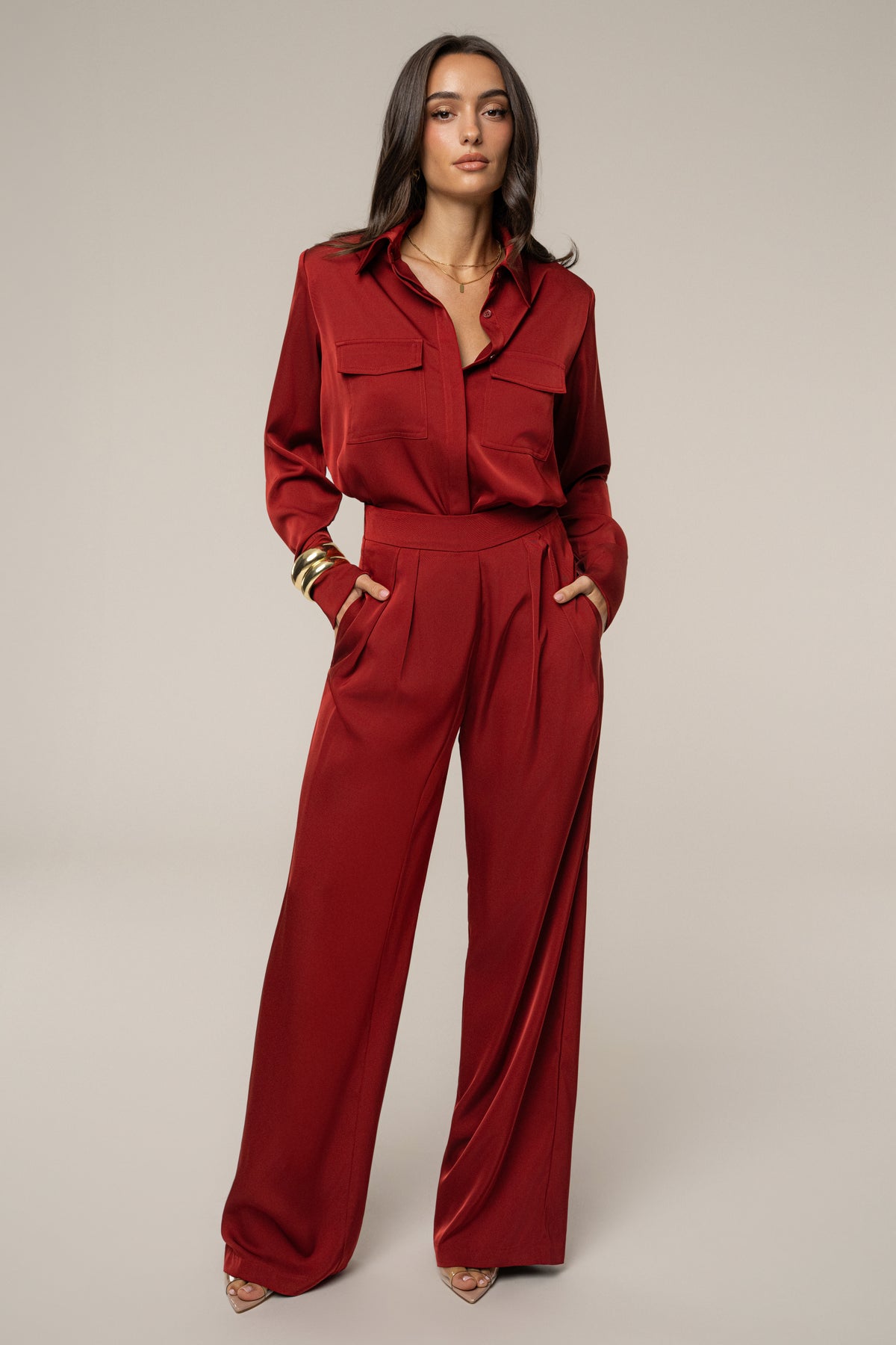 Burgundy Candice Trousers by JLUXLABEL, stylish bottoms featuring a tailored fit and smooth fabric, displayed on a model.
