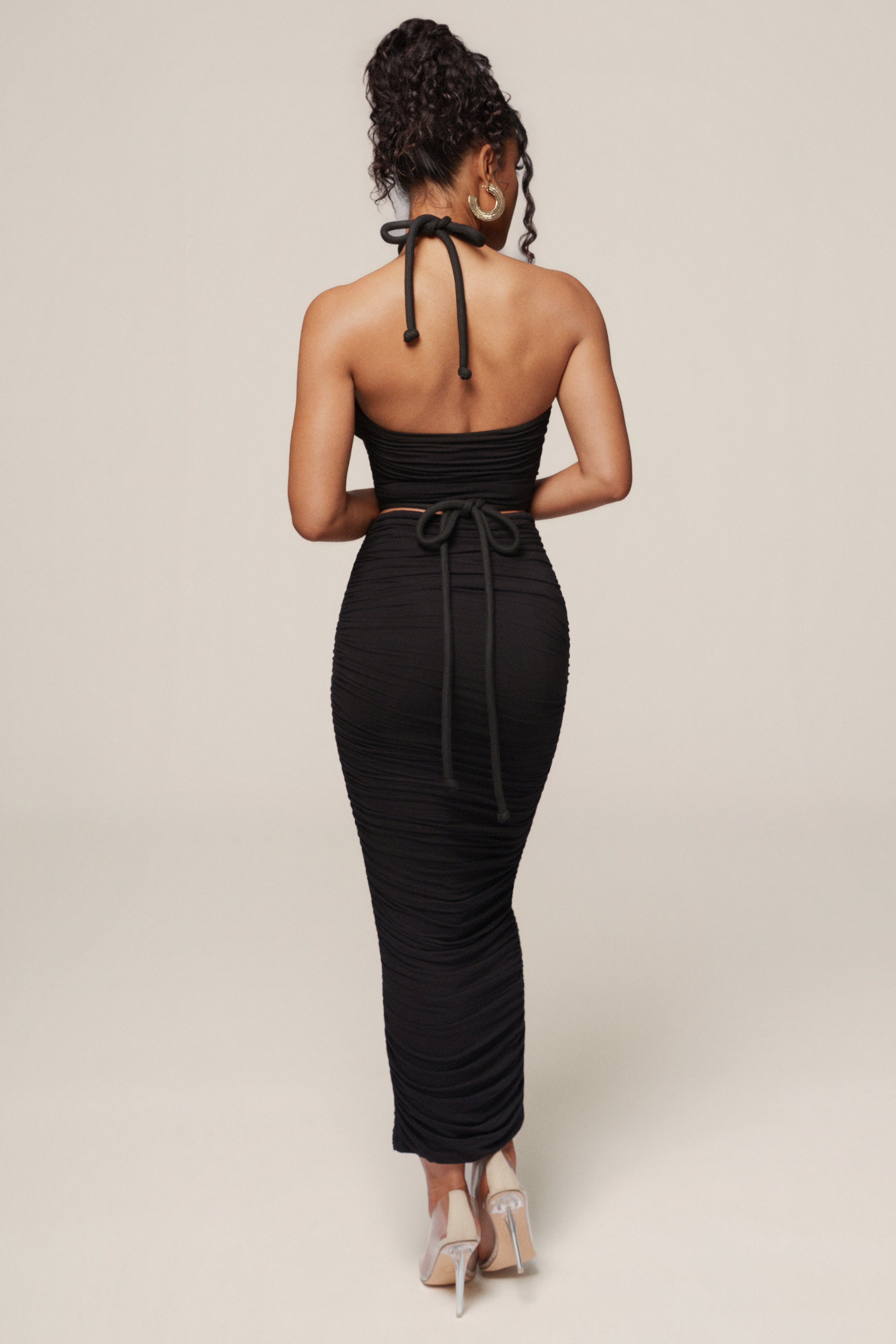 Black Go The Distance skirt set by JLUXLABEL featuring a fitted skirt and matching top, styled for casual or sporty looks.
