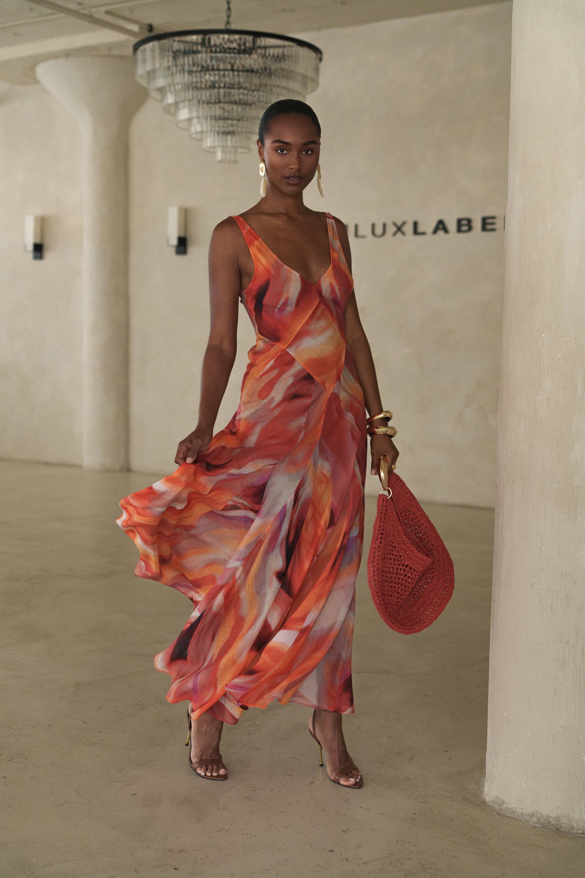 Red Prism Tide Maxi Dress by JLUXLABEL featuring a flowing silhouette and vibrant color, perfect for elegant occasions.