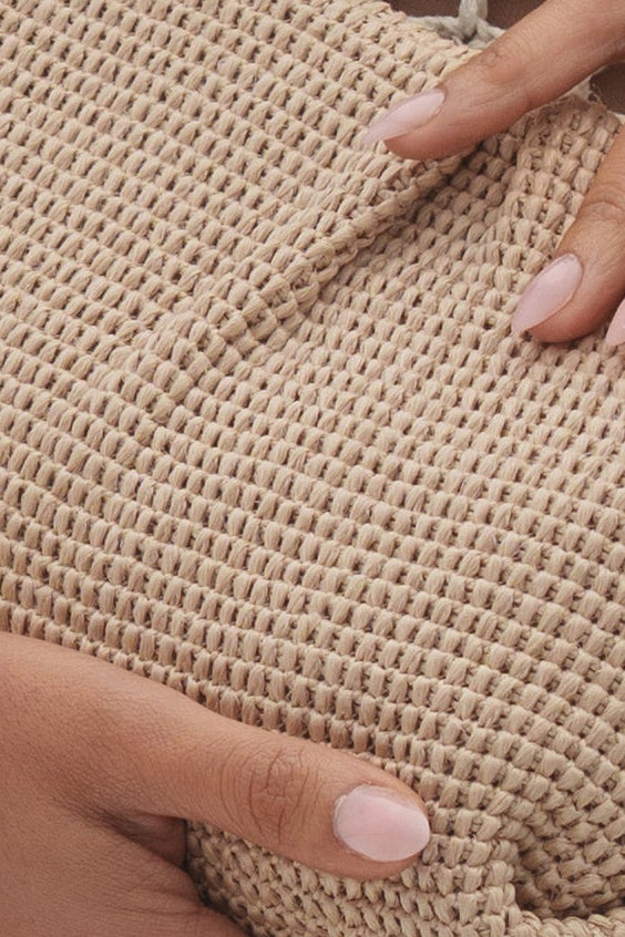 Beige Ocean Club clutch bag by JLUXLABEL, elegant accessories with a sleek design, shown on a plain background.