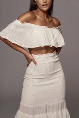 close up of white ruffled skirt set